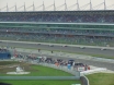 Champs cars racing in front of the grandstand on the opening race Thumbnail